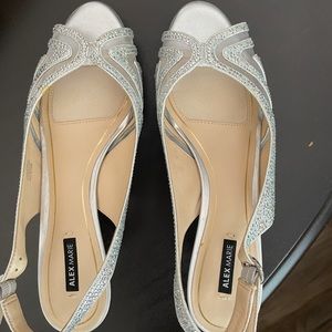 Brand new, never worn silver heels.